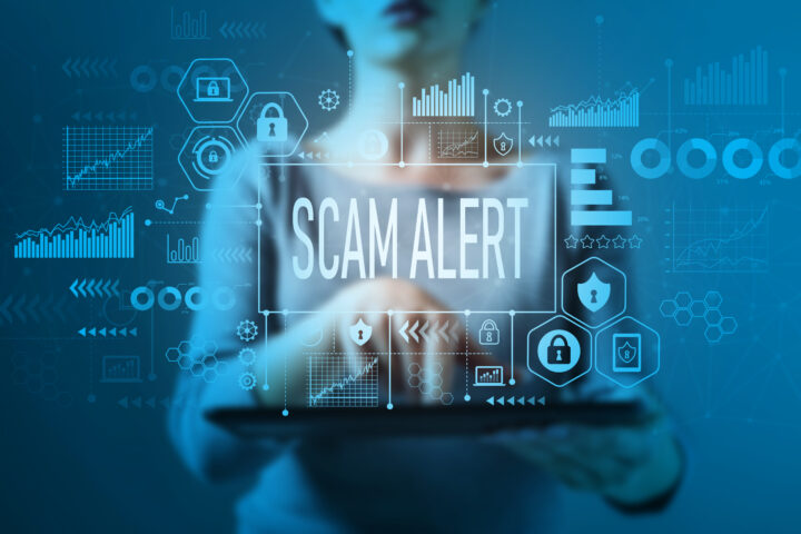 Email scam alert with business woman using a tablet computer
