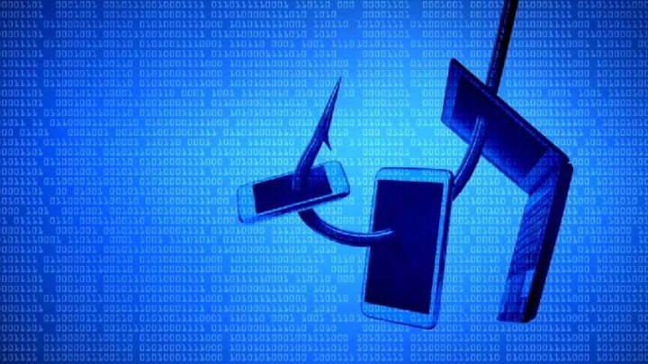 Fishing hook threaded through a phone, tablet and laptop in front of a blue background