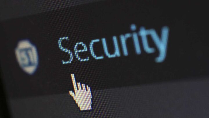 close up of computer with cursor hovering over the word security