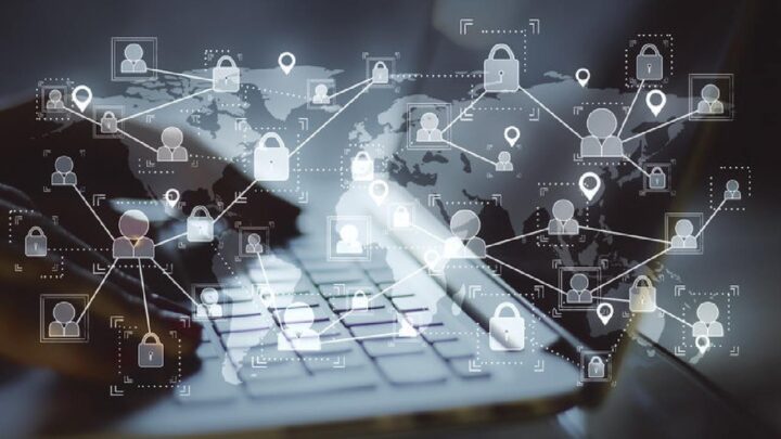 Person using computer with network graphics